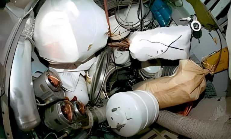 The three tanks in the lower left corner of the picture are metal tanks filled with liquefied gas used to make oxygen on the Mir space station. 