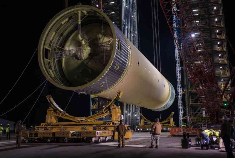 The core stage fuel tank of the Space Launch System (SLS) being erected for structural strength testing 